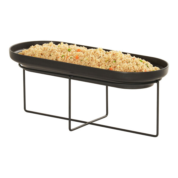 A black oval wire riser with food in it.