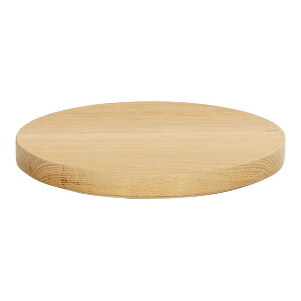 A Cal-Mil oak wood round tray on a table.