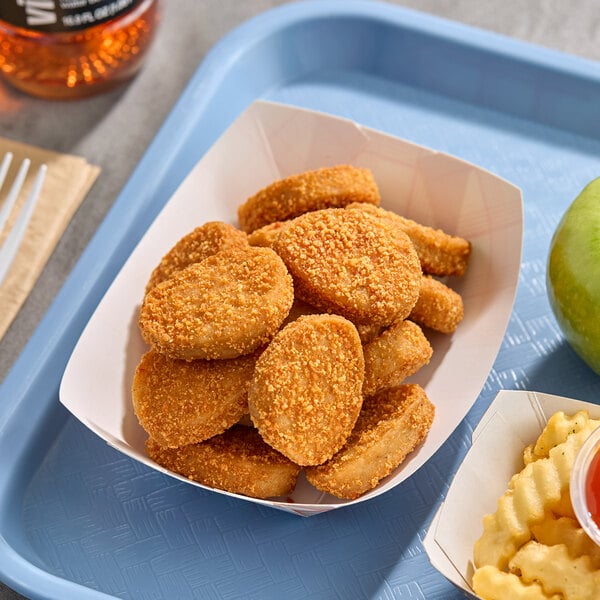 A serving of breaded, plant-based spicy chicken nuggets in a paper tray.
