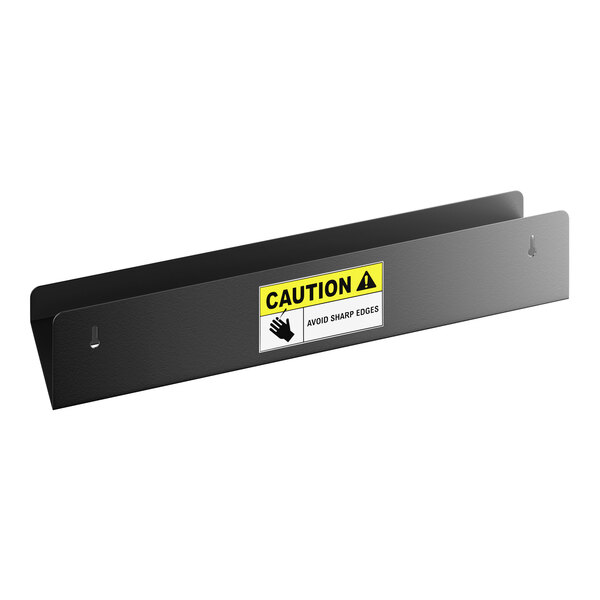 A matte black stainless steel shower shelf with a caution label on the front.