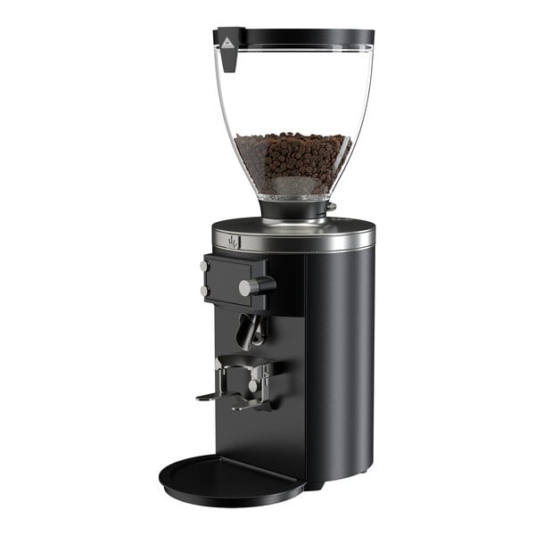 A black on-demand espresso grinder with a clear hopper containing coffee beans.