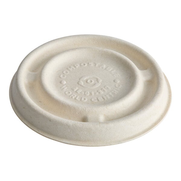 A compostable fiber lid designed for a 2 oz. portion cup.