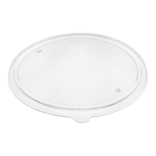 A clear, round compostable plastic lid designed to fit a 32 oz. wide fiber take-out bowl.