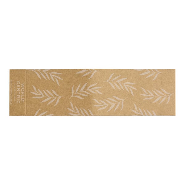 A brown rectangular paper sleeve with white leaves on it.