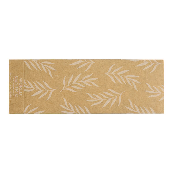 A brown paper sleeve with white leaves on it.