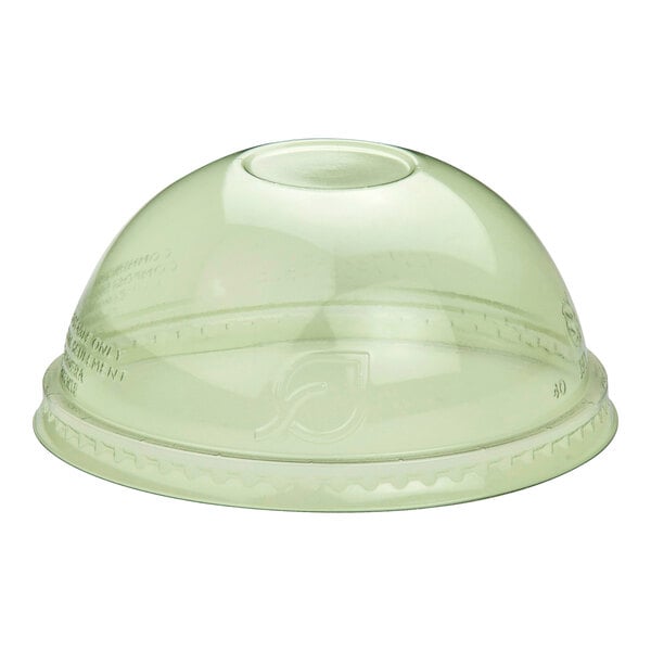 A green compostable plastic dome lid for cold cups with a straw hole in the center.