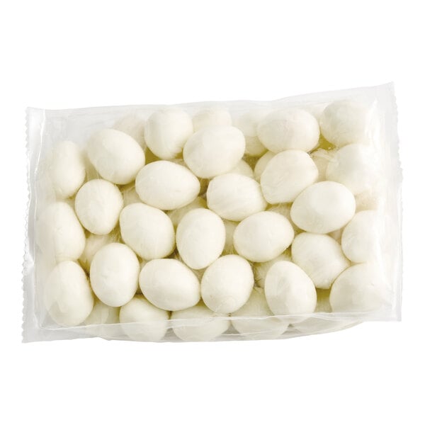 A vacuum-sealed plastic bag containing multiple hard-cooked eggs.