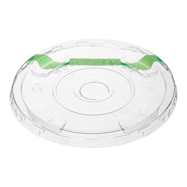A clear compostable plastic cold cup lid with a green straw slot.