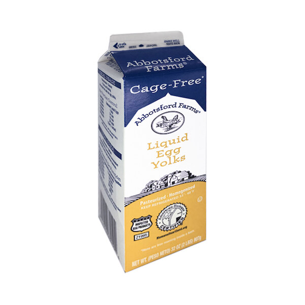 A close-up of a carton of Abbotsford Farms liquid egg yolks.