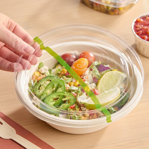 A clear compostable plastic lid designed to fit 16-32 oz. fiber bowls and 42 oz. NoTree wide paper bowls.