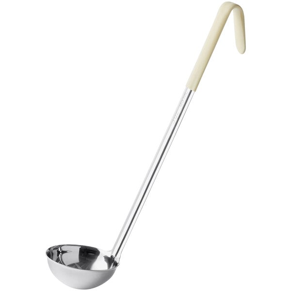 A stainless steel ladle with an ivory handle.