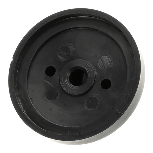 A black circular thermostat knob with holes in it.