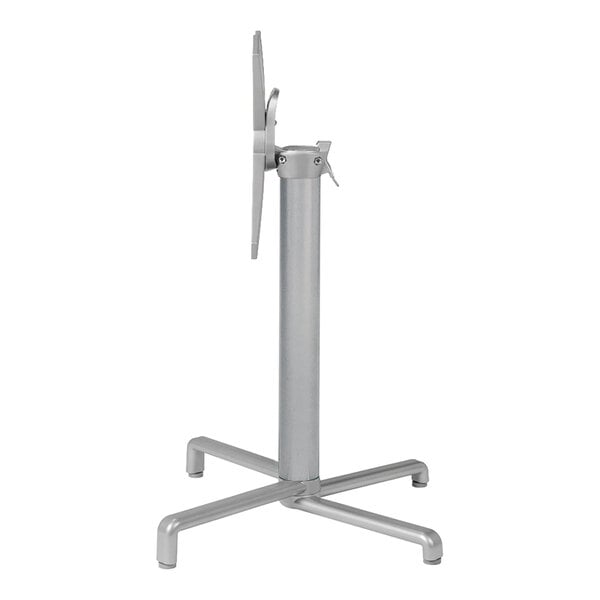 A silver metal table base with a tilting mechanism designed for standard height table tops.