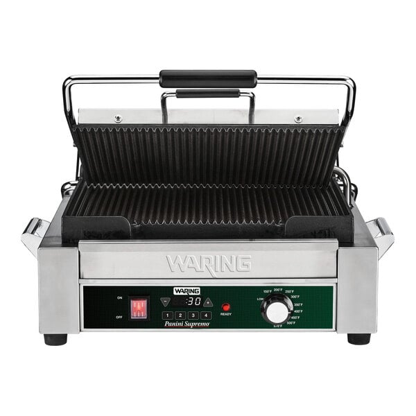 A Waring Panini Supremo grill with a handle and a timer dial.