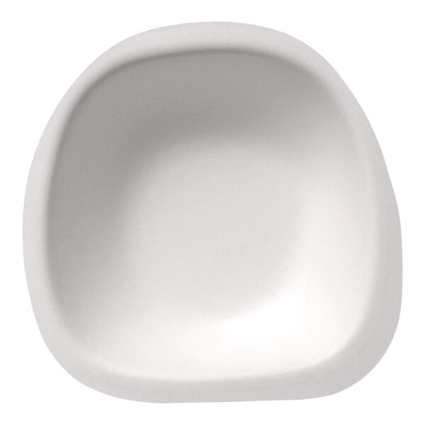 A close-up of a Jungle Stone white compostable bowl with a rounded edge.