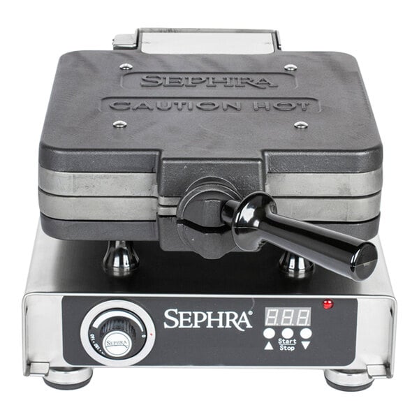 A commercial cast iron press-style waffle maker with ice cream cone plates by Sephra.