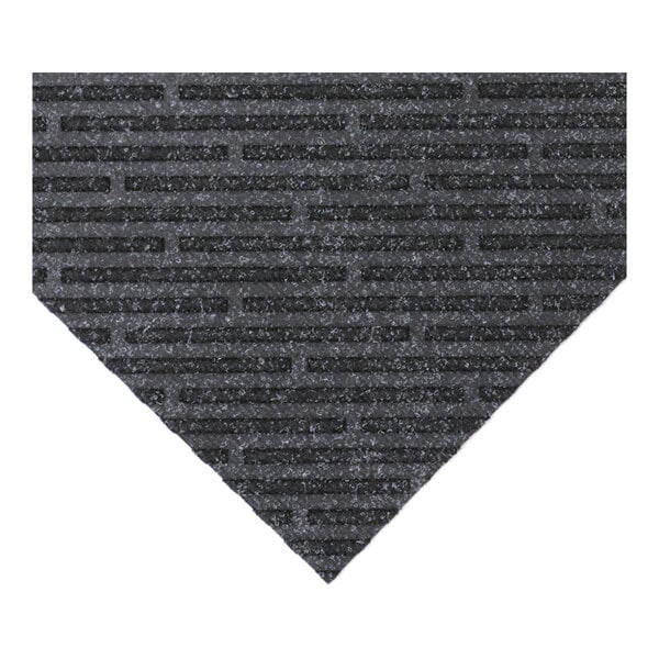 A dark gray entranceway carpet tile with a broken diagonal line pattern.