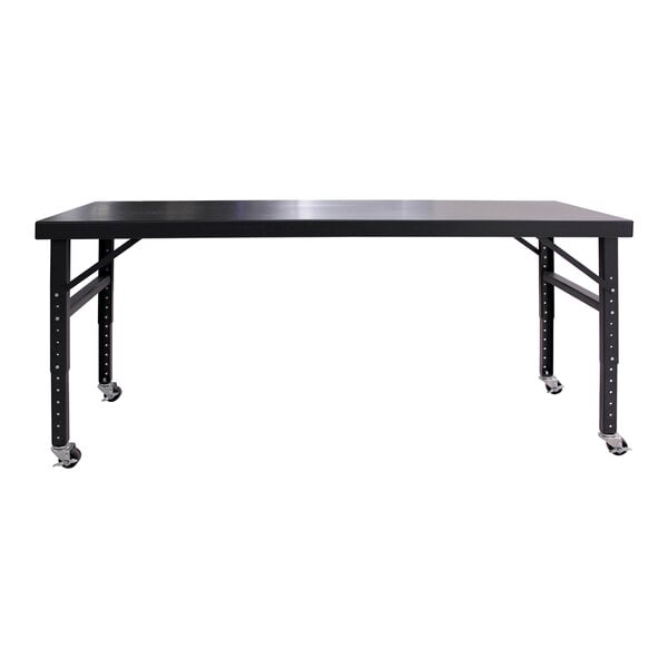 A large black mobile adjustable height work table with a flat rectangular surface and four legs on caster wheels.