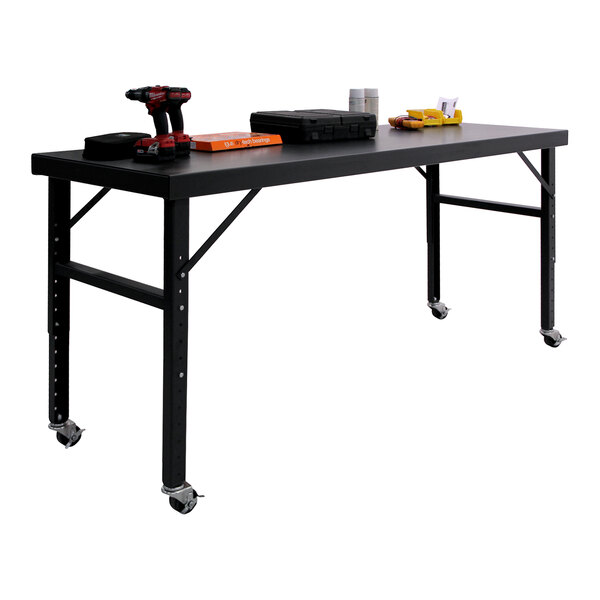 A large black mobile adjustable height work table with tools and supplies on top.