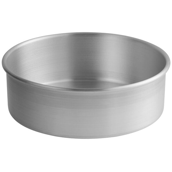 A Choice aluminum round cake pan with straight sides.