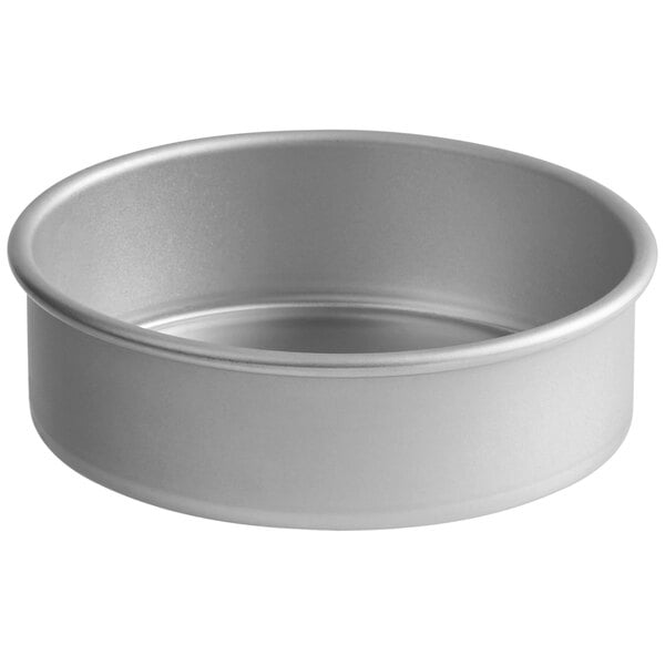 A silver round straight-sided cake pan.