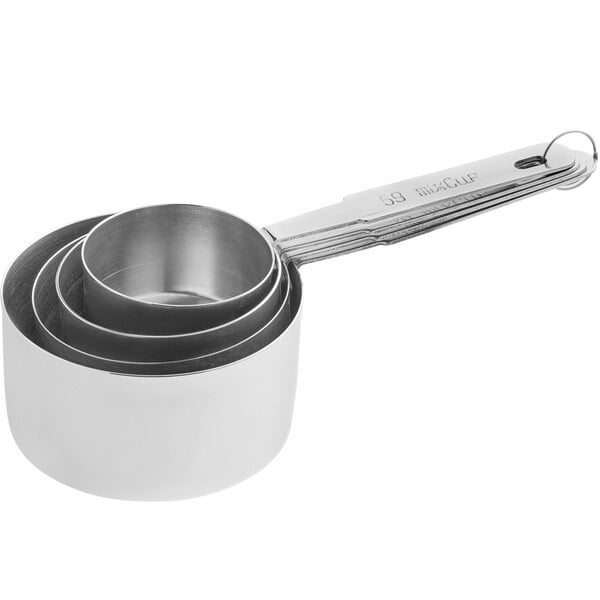 A set of four stainless steel measuring cups nested together with a metal ring.