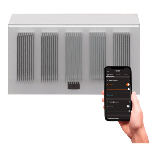A hand holding a cell phone with a Bromic Heating smart dimmer controller screen displayed.