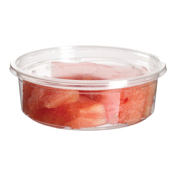 A Eco-Products clear plastic deli container with pieces of watermelon inside.
