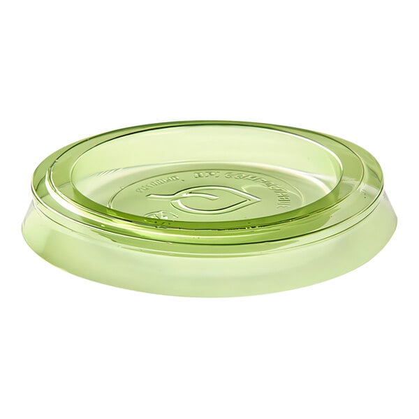 A green Eco-Products compostable plastic lid on a table with green Eco-Products portion cups.