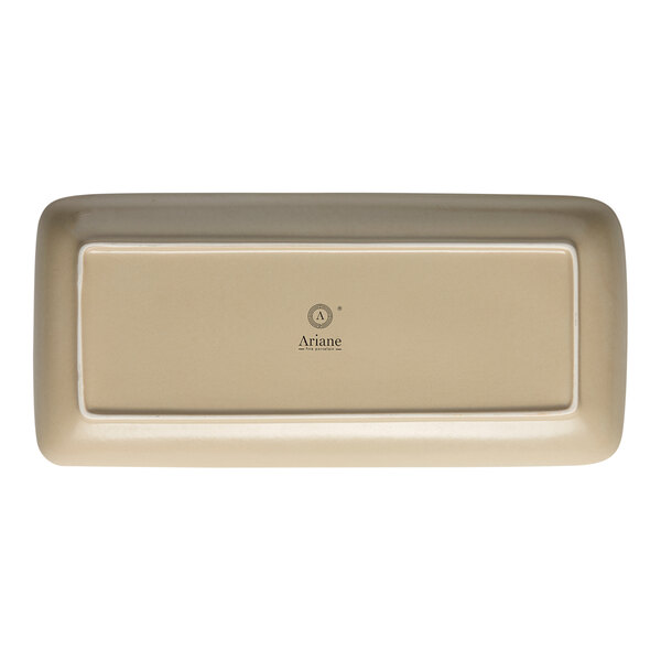 A rectangular white porcelain plate with a rectangular sand dollar design.