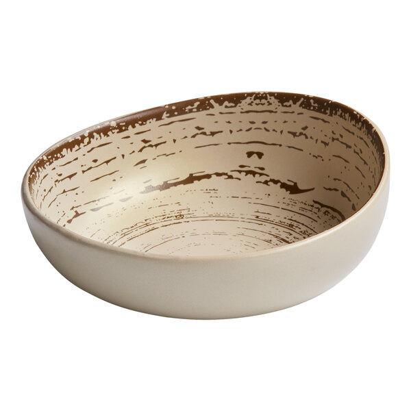 A white Ariane coupe bowl with brown specks.