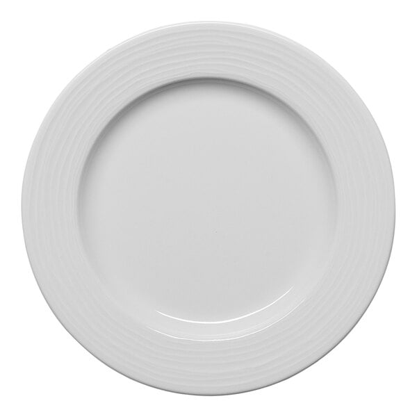 A white round porcelain plate with an embossed wide rim.