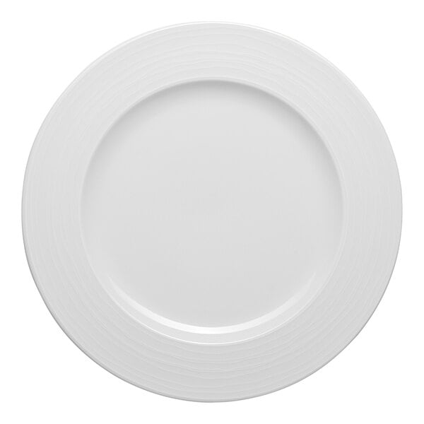 A white round porcelain plate with an embossed wide rim.