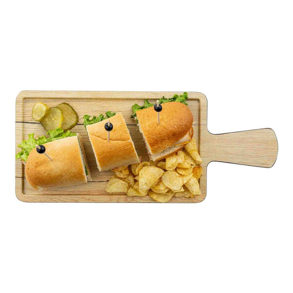 A rectangular faux wood melamine serving tray with a handle, shown holding three sandwich pieces, potato chips, lettuce, and pickles.