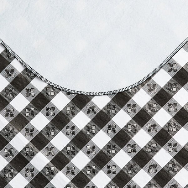 A black and white gingham vinyl table cover with a flannel backing.