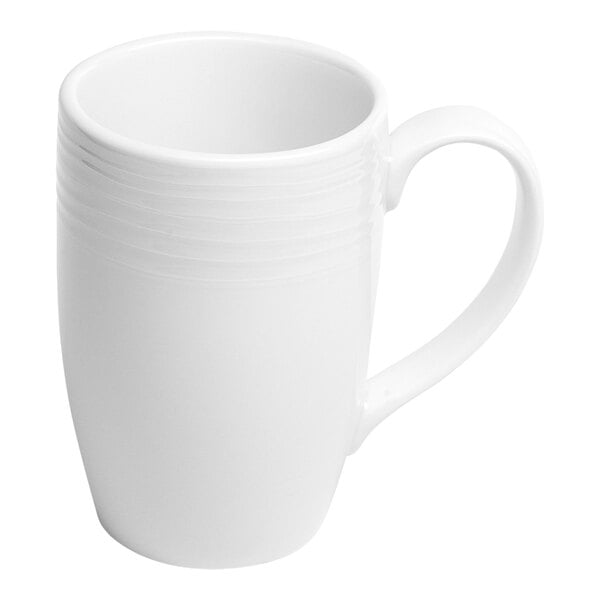 A white porcelain mug with an embossed design and a handle.