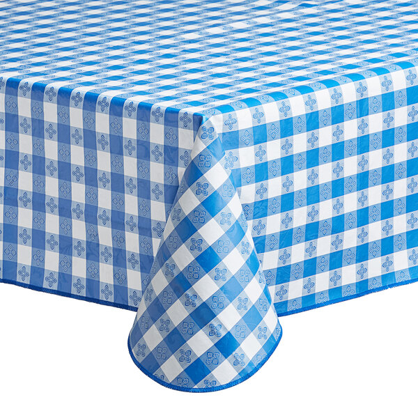 A rectangular royal blue and white gingham vinyl table cover with a flannel back.