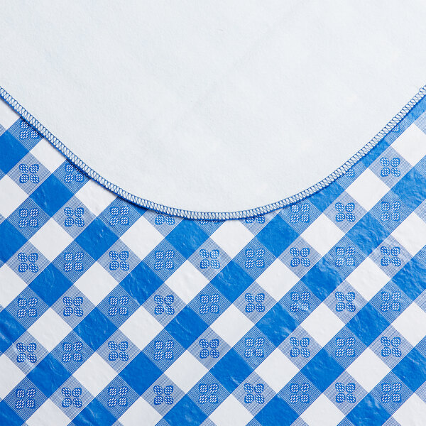 A rectangular royal blue and white gingham vinyl table cover with a flannel backing.