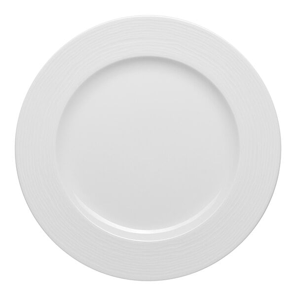 A white round porcelain plate with an embossed wide rim.