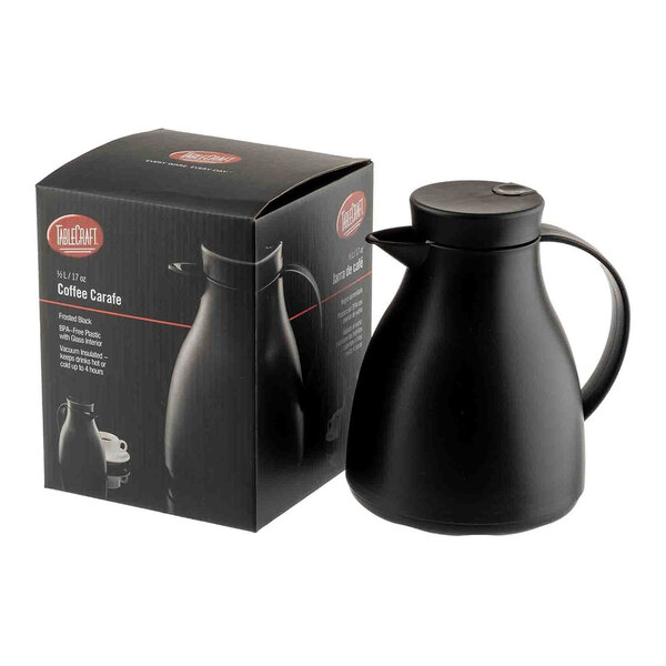 A black plastic coffee carafe with a glass liner, shown next to its packaging box.