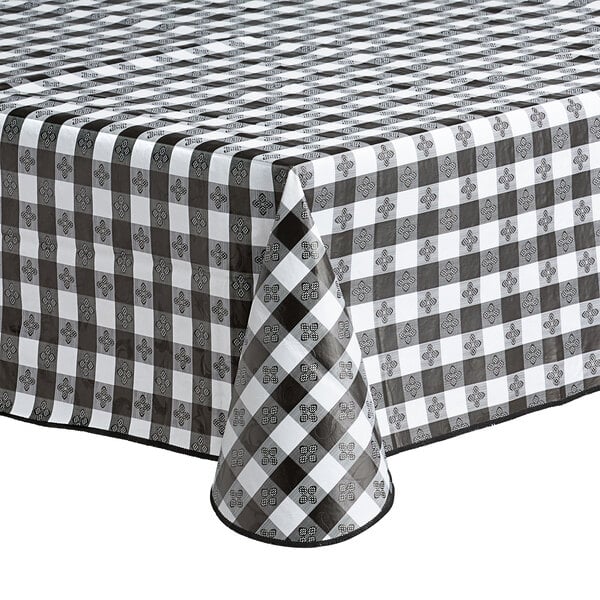 A rectangular black and white gingham vinyl table cover with a flannel back.