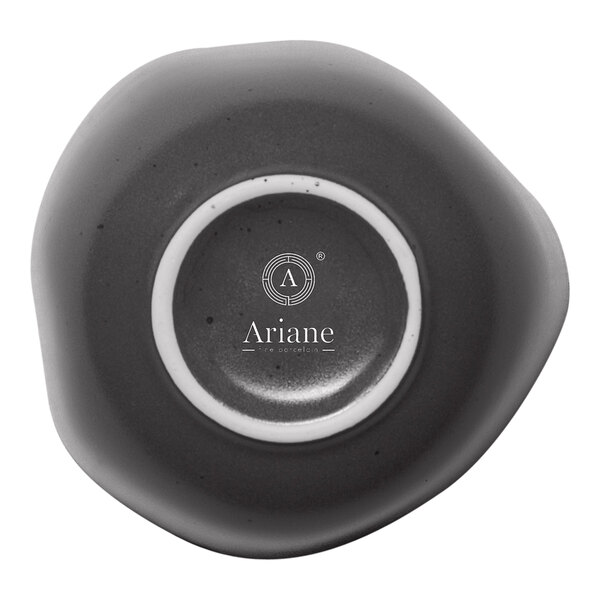 A black and white ceramic bowl with the word Ariane in a white circle.