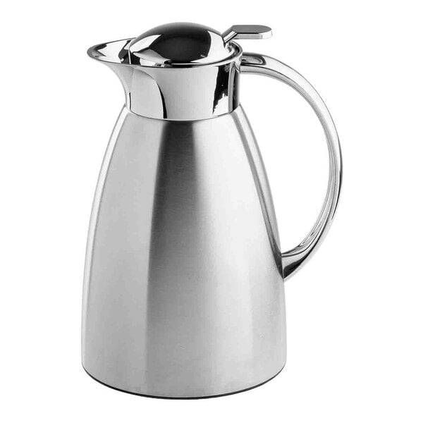 A stainless steel coffee carafe with a handle and spout.