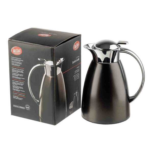 A black stainless steel coffee carafe with a chrome handle and lid, shown next to its packaging box.