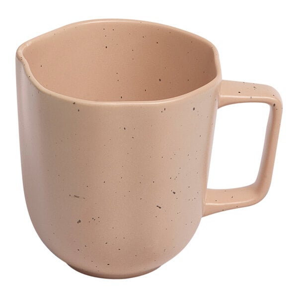 An Ariane dark sand porcelain mug with speckled dots.