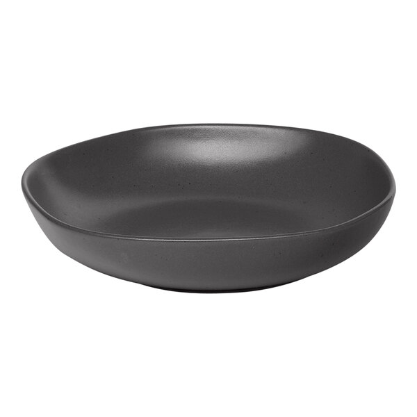 An Ariane porcelain plate with charcoal grey dots on a white background.