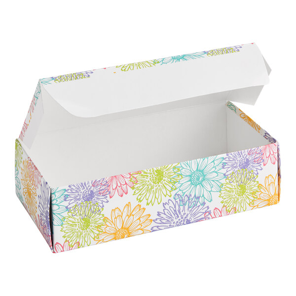 A rectangular cardboard candy box with a hinged lid, decorated with colorful floral patterns.