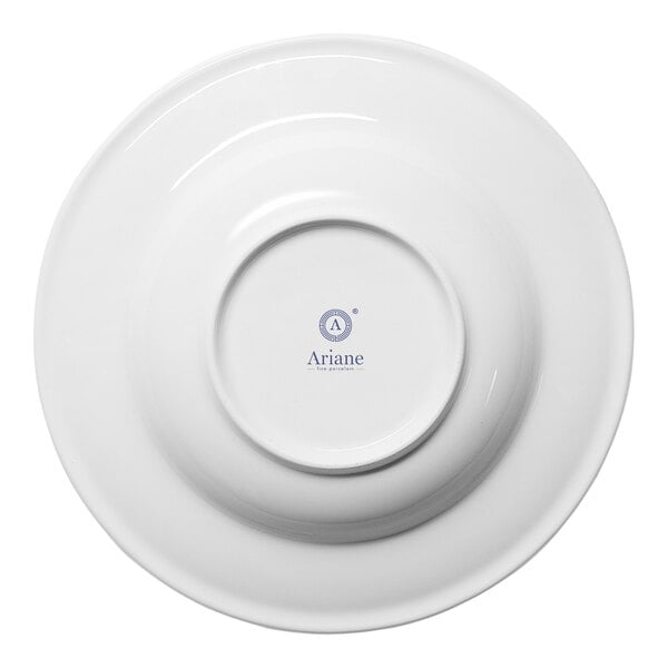 A white round porcelain plate with a wide rim, shown from the bottom with the Ariane brand logo visible.