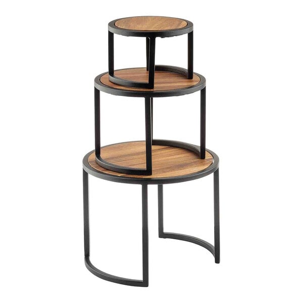 A three-piece round riser set made of acacia wood and steel, stacked in graduated sizes.