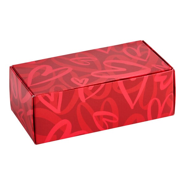 A rectangular red candy box with a modern heart pattern design.